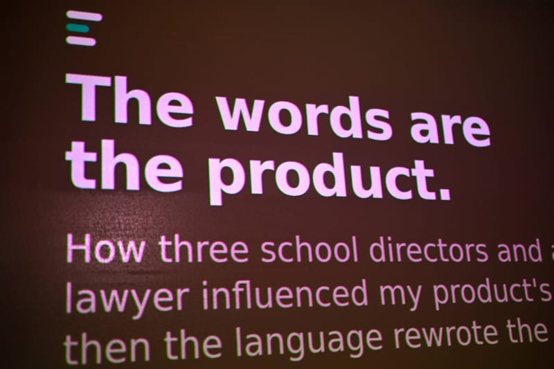 A projected slide reading the words are the product, how three school directors and a lawyer influenced my product.